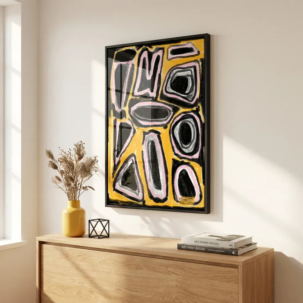 Bold yellow, black and grey geometric-shape abstract print in a black frame above an oak sideboard, illustrating the De Stijl design language