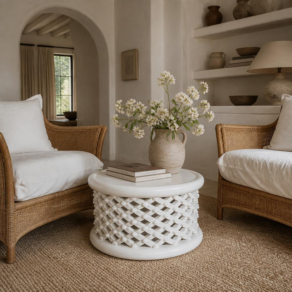 White Bamileke Stool, Ø60 × H40 cm between two cane armchairs