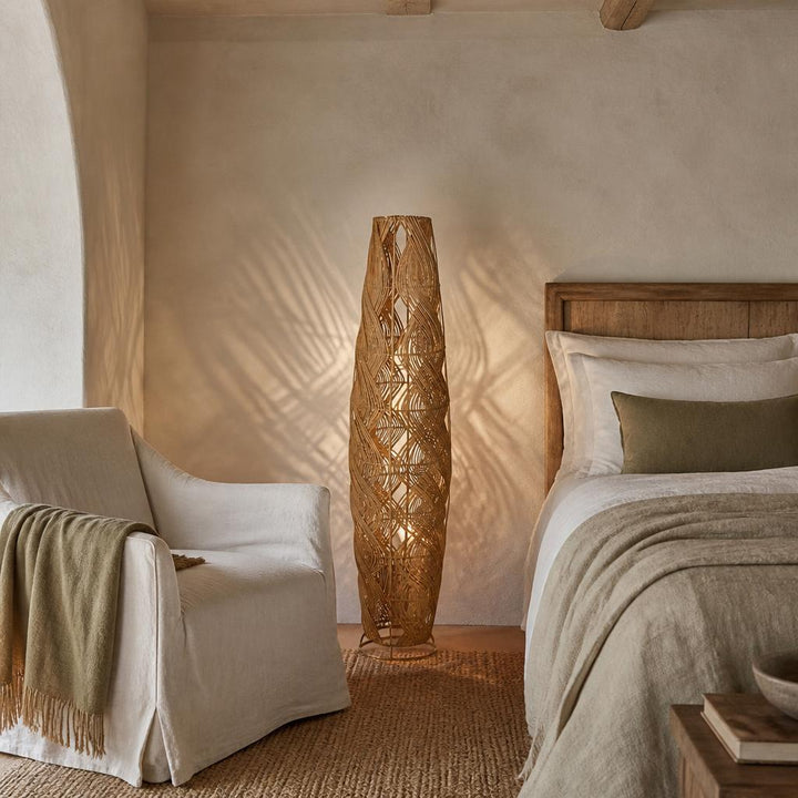 Ellipse Rattan Floor Lamp styled in a room