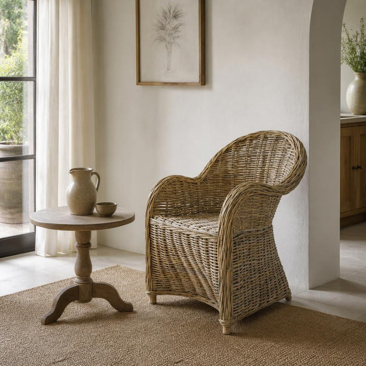 Rattan Dining Chair with Arms styled in a room